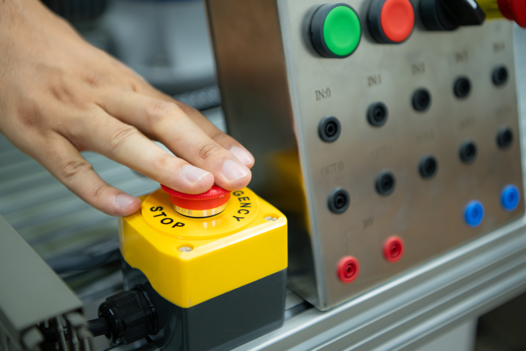 closeup of hand pressing stop button